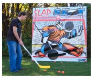 lot 222 image: Slap Shot Hockey Game 6 x 6 backdrop, hockey stick & ball in case.