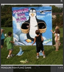lot 227 image: Penguin Fish Fling Game 6 ft x 6 ft backdrop in case.