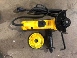 lot 17 image: DEWALT 11 Amp Corded 4.5 in. Small Angle Grinder  Customer Returns See Pictures