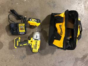 lot 21 image: DEWALT 20V MAX Lithium-Ion Cordless 12 in. Impact Wrench Kit   Customer Returns See Pictures