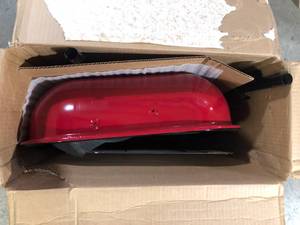 lot 24 image: Americana Swinger Charcoal Grill in Red   Customer Returns See Pictures