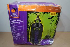 lot 123 image: Home Accents 5 Motion Activated Standing Bobble Head Witch
