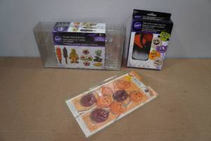 lot 130 image: Wilton Halloween Themed Candy Molds and Cookie Cutters