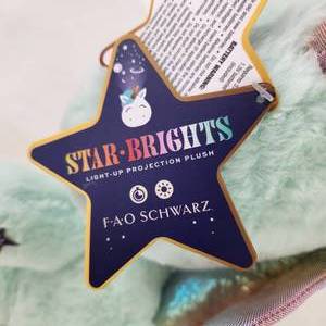 lot 20 image: FAO Schwarz Star Brights LED Color Changing Projector Dragon 12 Plush