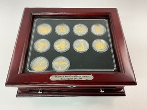lot 1 image: 10pc Platinum and Gold Highlighted U.S. Silver Dollars in Cherrywood Box