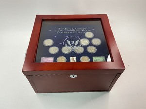 lot 31 image: 75pc JFK Uncirculated Coin and Stamp Centennial Collection