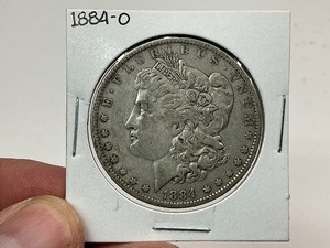 lot 55 image: 1884-O Silver Morgan Dollar
