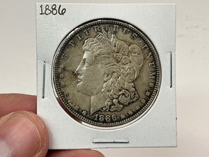 lot 57 image: 1886 Silver Morgan Dollar
