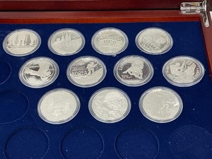 lot 77 image: 11pc Set of U.S. Military Silver Dollars