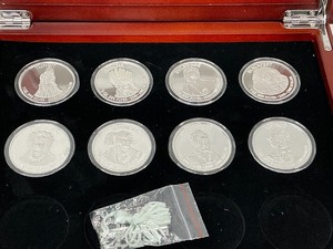 lot 78 image: 8x Native American Silver Dollars in Cherrywood Box
