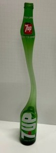 lot 25 image: Vintage Carnival Stretched 7Up 1960s Soda Pop Bottle Original Recipe