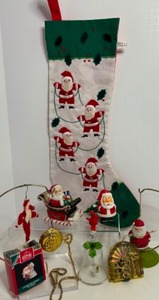 lot 231 image: Here Comes SANTA CLAUS Christmas Decorations, Stocking, Ornaments, Bells & More