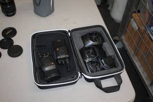 lot 1037 image: RadioBoss 2-Way Portable Radio Set - (2) Radios, (4) Batteries, (2) Charging Stations with power cords and (1) Case