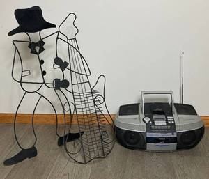 lot 70 image: Vintage Wire Man Playing A Guitar CD Holder and Aiwa CDRadioCassette Player