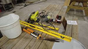 lot 24 image: Lot of Tools and Accessories Including Saw, Drill, and Tape Measure