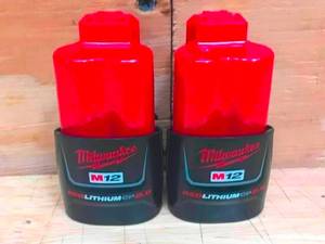 lot 35 image: Lot of 2 - Milwaukee M12 Red Lithium 2Ah Battery Model # 44-11-2420 (Retail $64.97 Each)