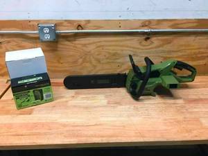 lot 20 image: Green Machine Cordless Chainsaw With 2.5AH Battery And Charger Model # GMCS6200