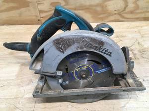 lot 27 image: Makita 15 Amp 7-14 in. Corded Lightweight Circular Saw Model # 5007MG