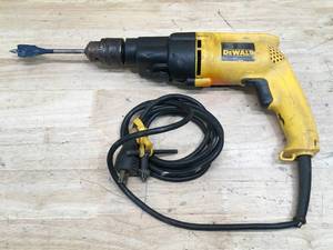 lot 94 image: DeWalt 12 VSR Hammer Drill Model # DW505