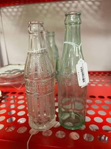 lot 299 image: Juniors Soda Bottle & Pluto Water Bottle