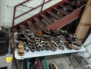 lot 250 image: Table Full of Brown Drip Pottery