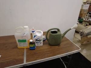 lot 25 image: Assorted Lawn Care Lot with Watering Can, Herbicide, and Weed Killer