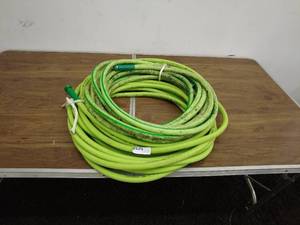 lot 110 image: Green Garden Hose with Nozzles