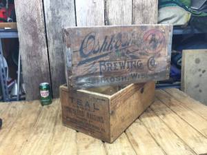 lot 104 image: Oshkosh Brewing Wooden Beer Crate - Teal Brand Raisin Crate