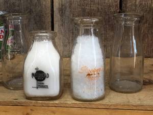 lot 156 image: 4 Vintage 12 Pint Milk Bottles