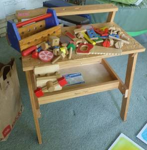 lot 14 image: Wood workbench and toolbox and a bunch of pieces to pound and put together