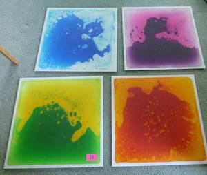 lot 15 image: FOUR Liquid (Lava) sensory tiles 19.75 inch square