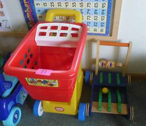 lot 21 image: TWO push toys - Little Tikes shopping cart and a cart with a ball that rolls on it