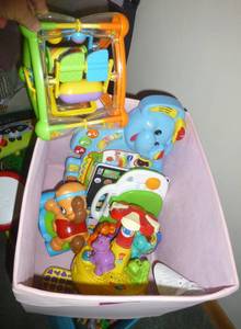 lot 99 image: Box of musical toys and learning tools including a Leap Frog