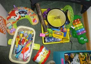 lot 101 image: Play doctor set, drums, rain stick, alligator xylophone