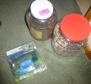 lot 126 image: Jars of bird seed and a window bird feeder