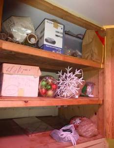 lot 178 image: Shelves full of christmas lights, paper, decorations