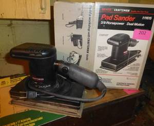 lot 202 image: Craftsman pad sander with a pack of sand paper
