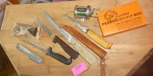 lot 214 image: Fishing knives, scaler, stone, reel, Perrine fly box