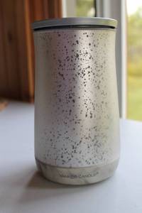 lot 35 image: Assorted Home Decor Items Including Yankee Candle, Vase, and Metal Frog Watering Can