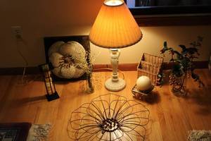 lot 81 image: Home Decor Assortment Lamp, Candle Holders, Basket, and Faux Plants