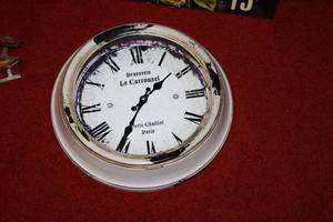 lot 149 image: Vintage Wall Clock, Decorative Planter Box, Wicker Vase with Faux Plant, and Antique Ice Skates