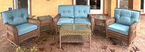 lot 119 image: Martha Stewart Living Outdoor Wicker Sofa, Swivel Chairs with Three Glass Top Tables
