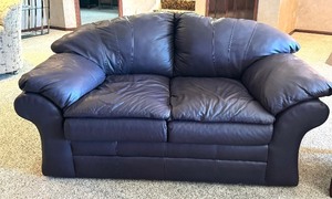 lot 214 image: Purple Leather Loveseat Sofa by Sealy