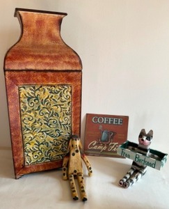 lot 77 image: Decorative Items Including a Large Embossed Metal Urn Style Garbage Can, 2 Wooden Cat Figures and a Coffee Tin Sign