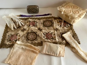 lot 226 image: Antique Victorian Lot of Linens - Cameo Childs Gloves, Socks & Gold Edged Centerpiece Tapestry