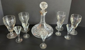 lot 267 image: The BAR is OPEN  Cut Crystal DECANTER Lot with a Silver Plated Lip & Etched Wine Cordial Glasses