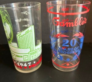 lot 280 image: Vintage MCM Collectible Commemorative GAMBLES DEPARTMENT STORE Measuring Glasses - Qty 2