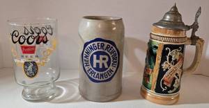 lot 114 image: All Things Beer Collectible Drinkware Including Henninger Reif Brau Stein