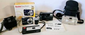 lot 254 image: Lot of Vintage Cameras Kodak, Canon, & Fujifilm wCases