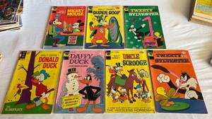 lot 40 image: Walt Disney (7) 20 and 25 Cent Comid Lot from 1973 and 1975 - Donald Duck, Mickey Mouse Goofy, Super Goof, (2) Tweety and Sylvester, Daffy Duck, Uncle Scrooge